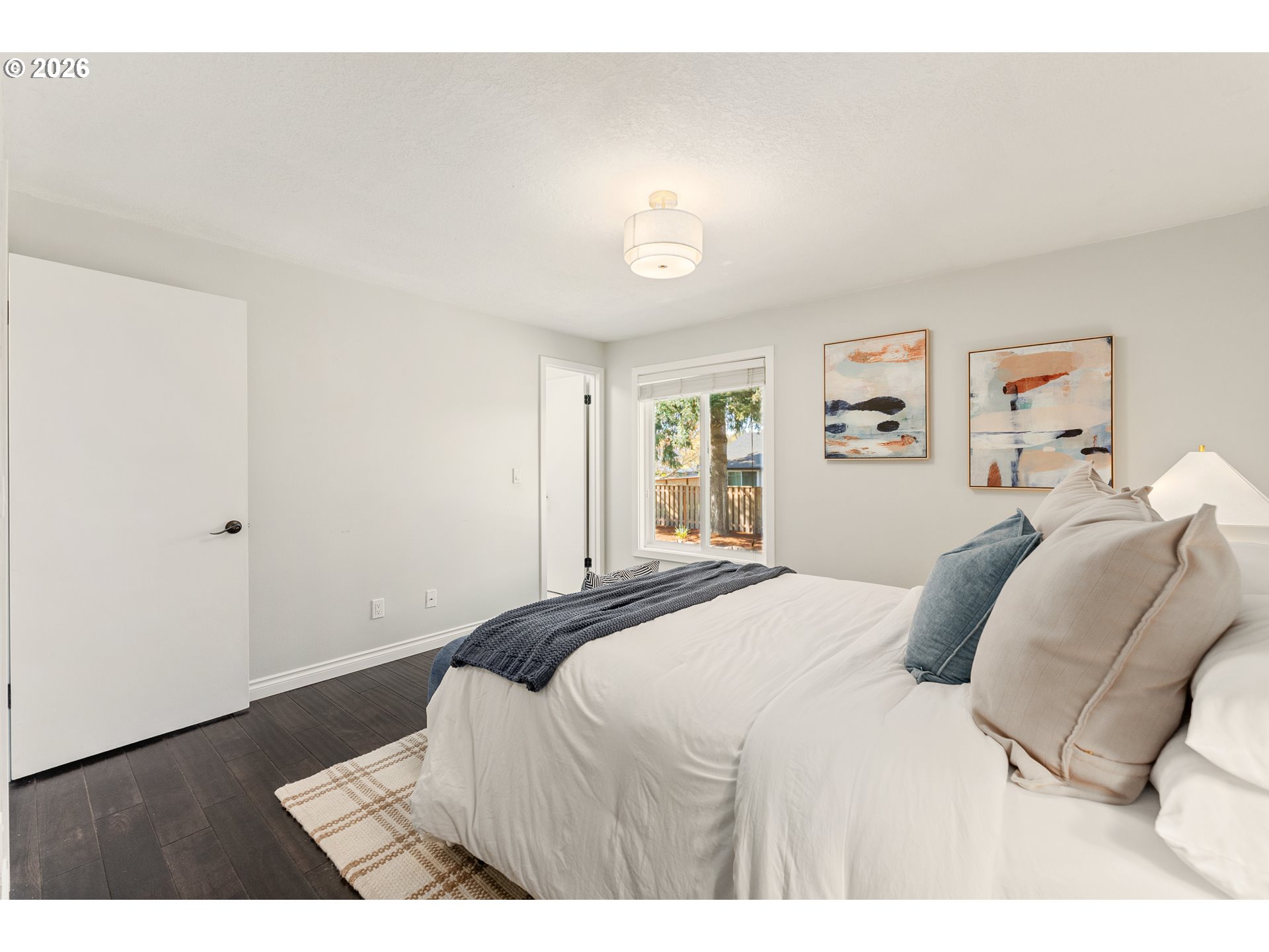 12785 Southwest Percheron Lane Beaverton, OR 97008 - Photo 22 of 42 a bedroom with a bed and a window