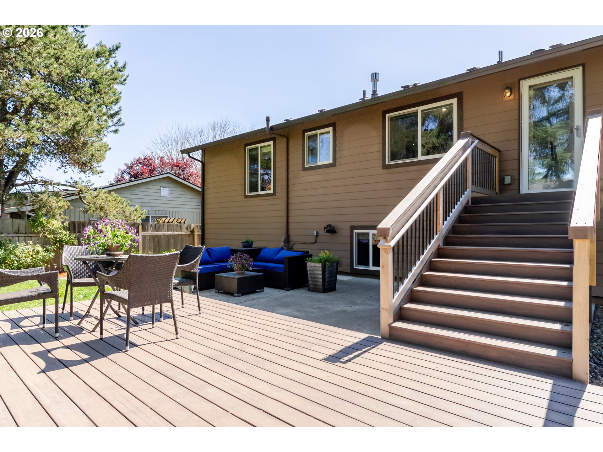 12785 Southwest Percheron Lane Beaverton, OR 97008 - Photo 42 of 42 a view of a house with wooden deck and furniture