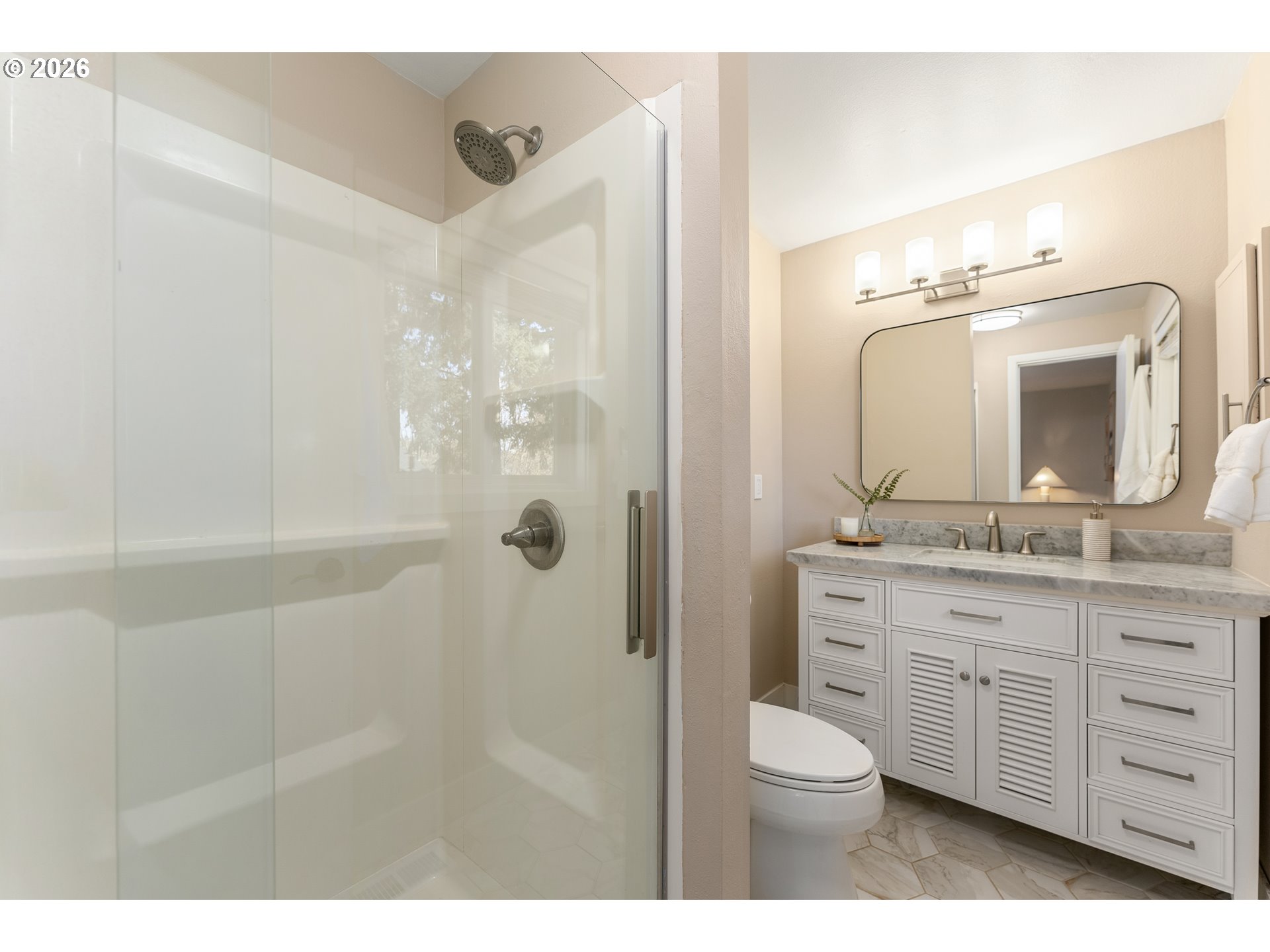 12785 Southwest Percheron Lane Beaverton, OR 97008 - Photo 7 of 42 a bathroom with a toilet a sink a mirror a shower a vanity and window