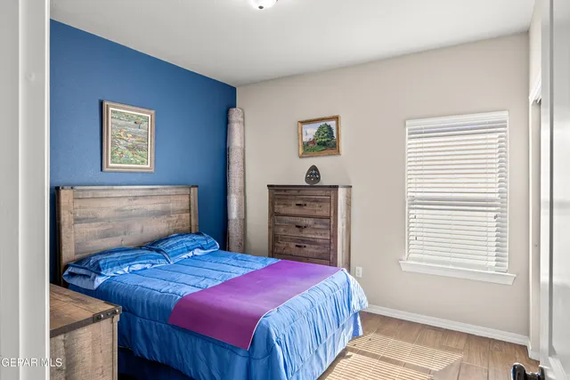 a bedroom with a bed and a closet