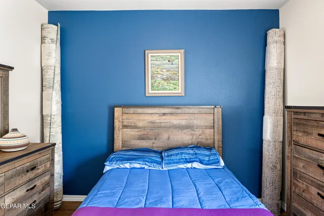a view of walk in closet with wooden floor