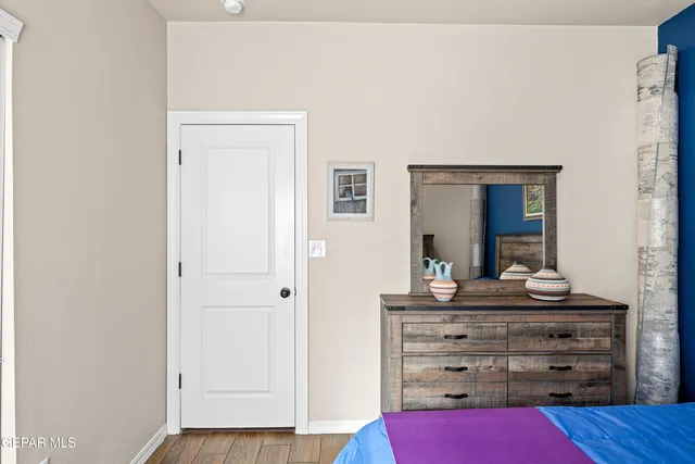 a view of room with wooden floor