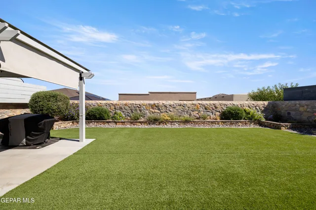 a view of a terrace with yard
