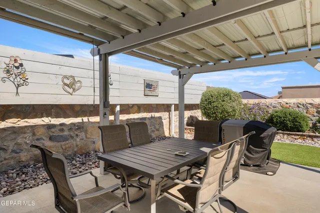 a view of a chairs and table in the patio