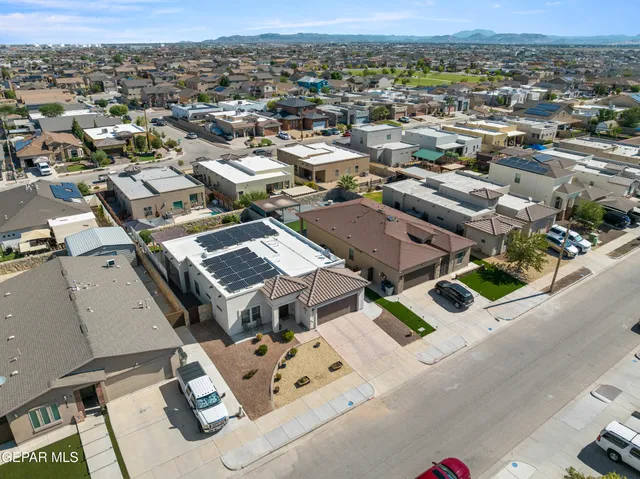 an aerial view of residential houses with outdoor space