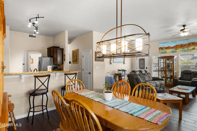 a dinning area with furniture and view of kitchen