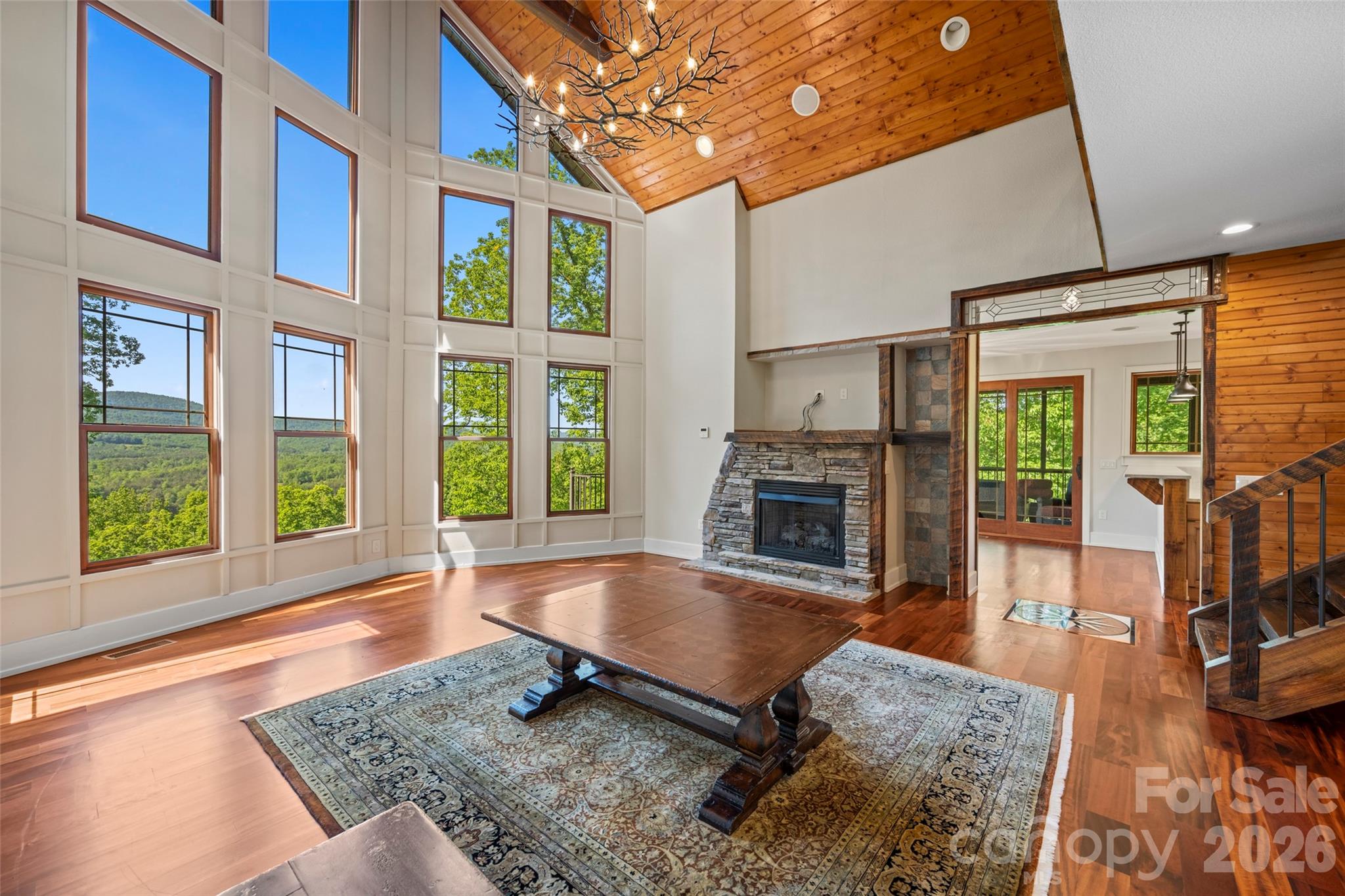 556 High Pines Loop Lake Lure, NC 28746 - Photo 11 of 46 a living room with furniture fireplace and flat screen tv