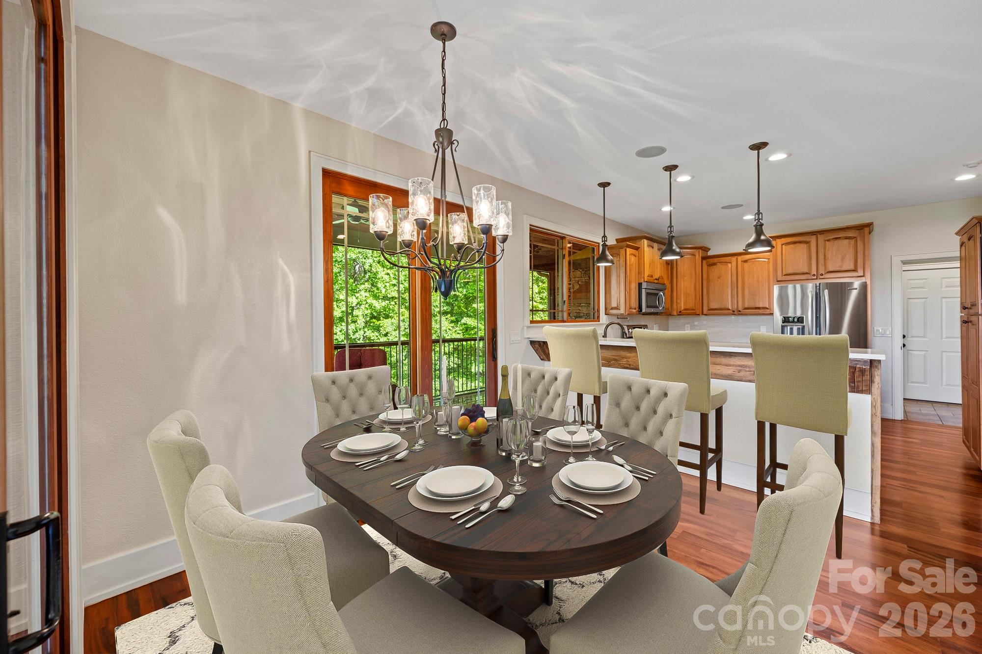 556 High Pines Loop Lake Lure, NC 28746 - Photo 12 of 46 a view of a dining room with furniture window and wooden floor