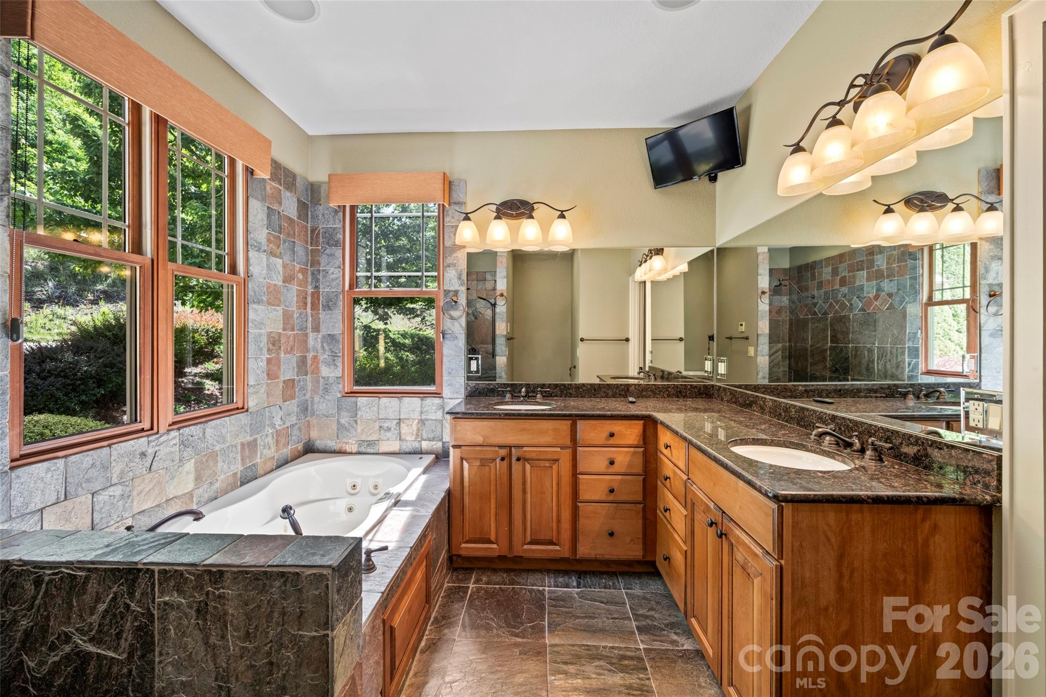 556 High Pines Loop Lake Lure, NC 28746 - Photo 20 of 46 a kitchen with stainless steel appliances granite countertop a sink and a stove