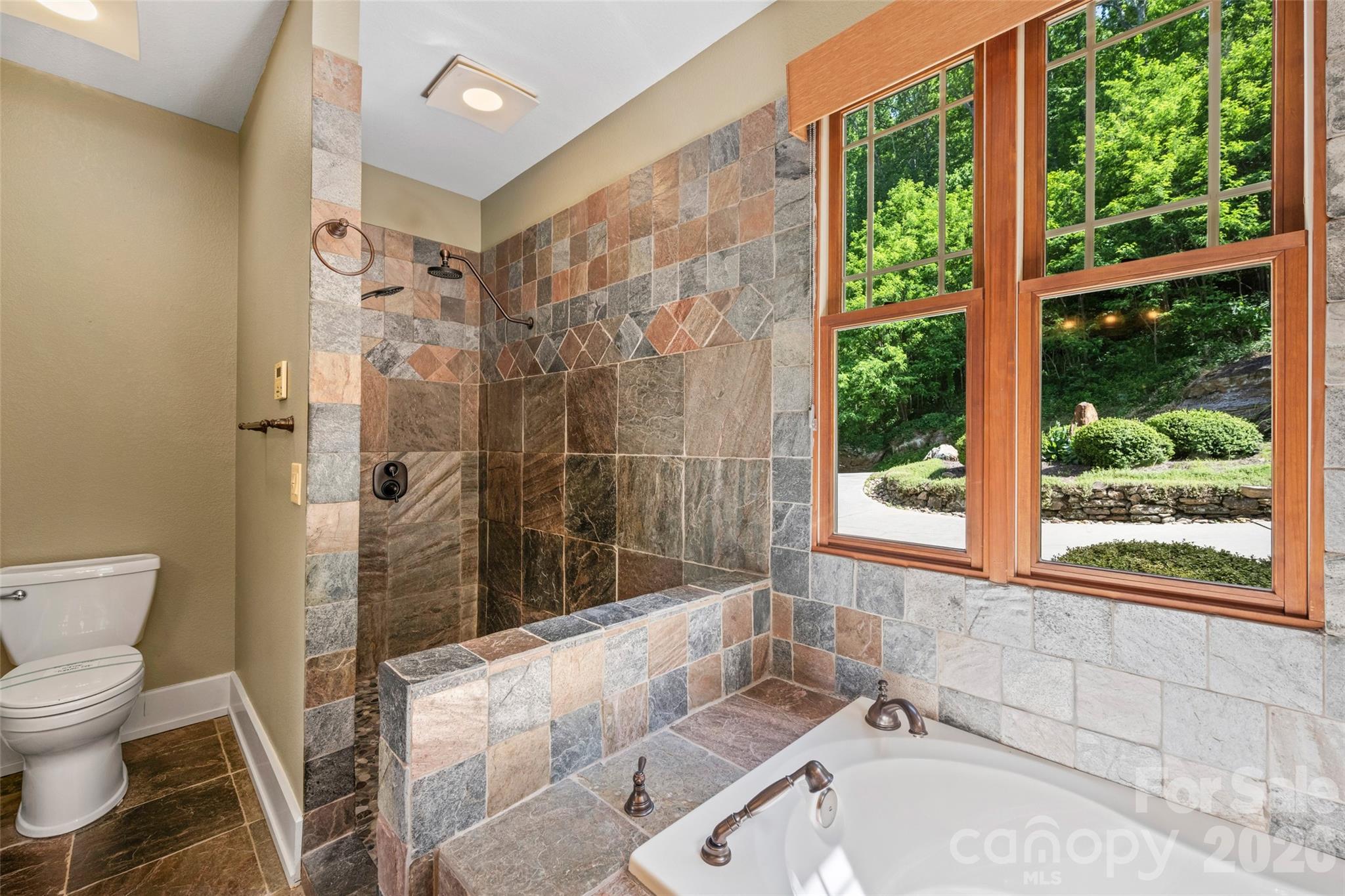 556 High Pines Loop Lake Lure, NC 28746 - Photo 21 of 46 a bathroom with a sink and bathtub with toilet