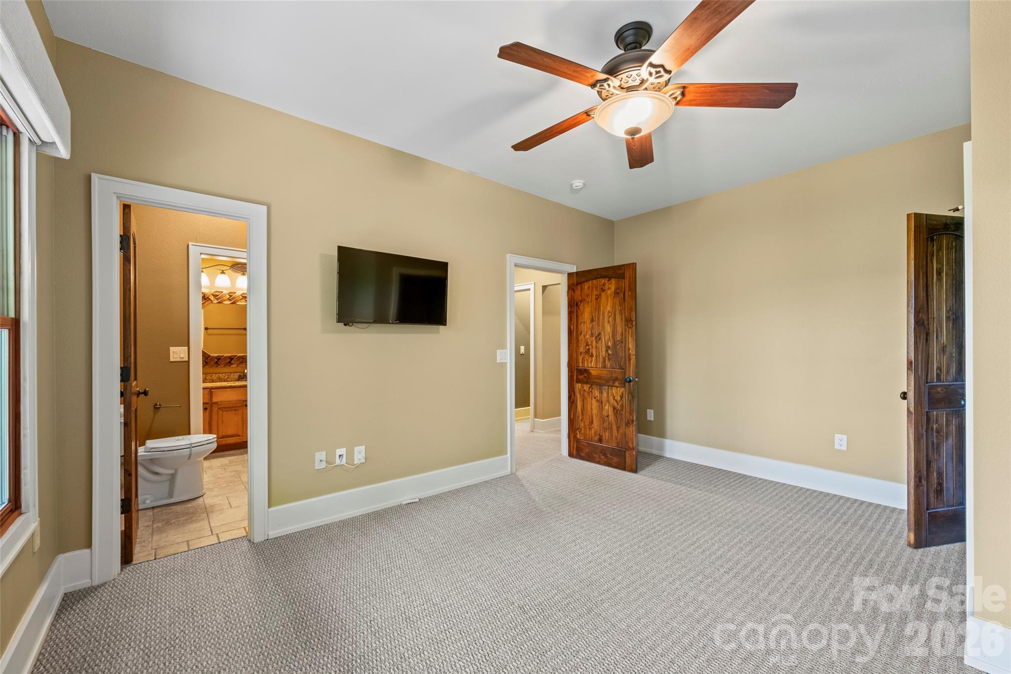 556 High Pines Loop Lake Lure, NC 28746 - Photo 24 of 46 a view of an empty room with a ceiling fan