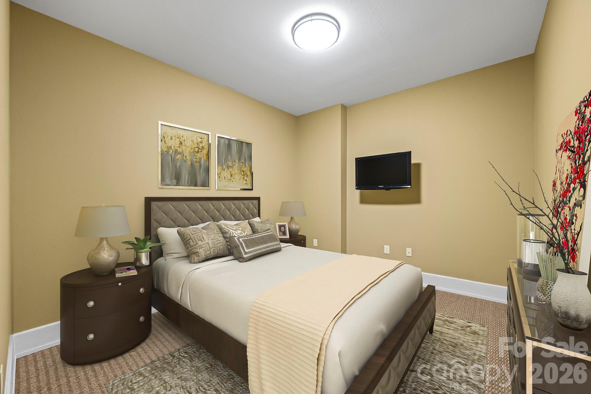 556 High Pines Loop Lake Lure, NC 28746 - Photo 26 of 46 a bedroom with a bed and a flat screen tv