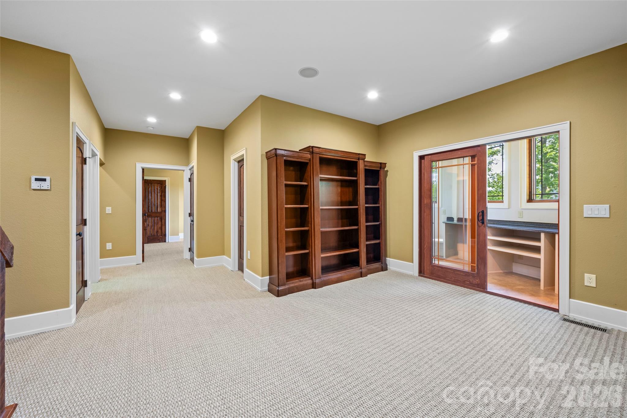 556 High Pines Loop Lake Lure, NC 28746 - Photo 27 of 46 a view of an empty room with a closet and cabinet