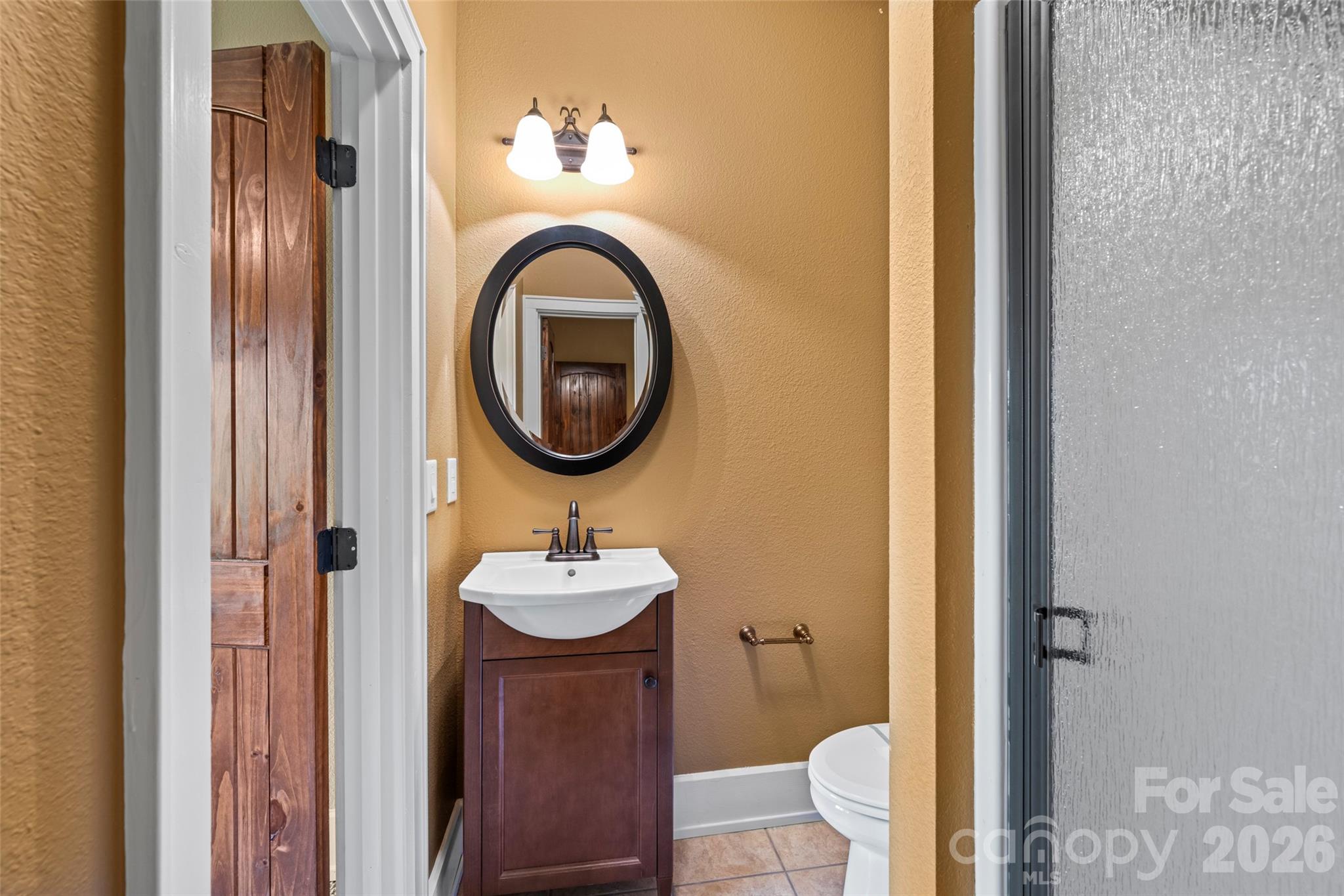 556 High Pines Loop Lake Lure, NC 28746 - Photo 32 of 46 a bathroom with a sink and a mirror