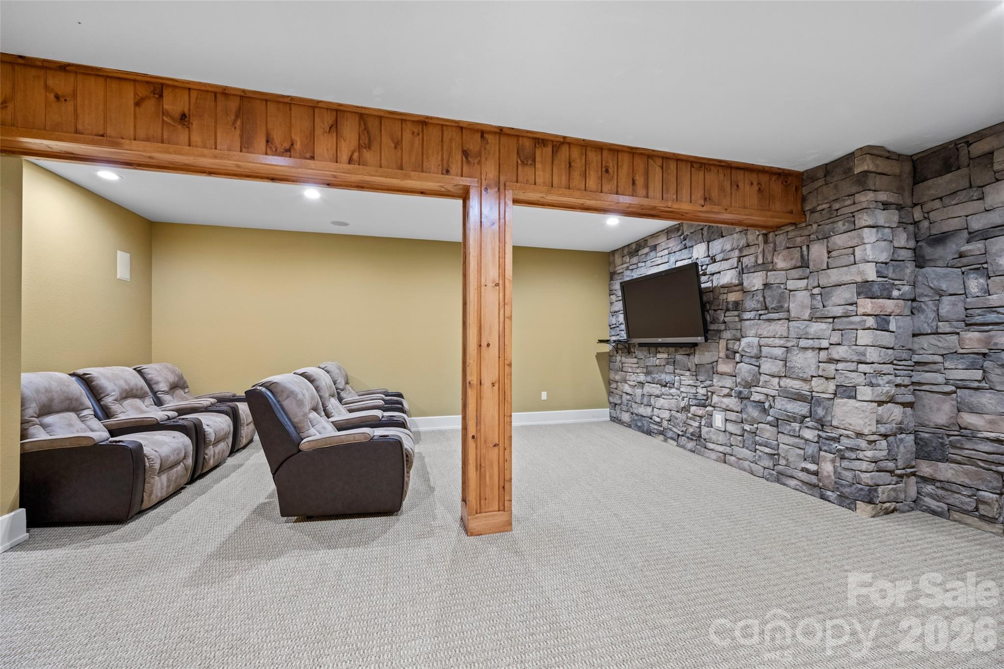 556 High Pines Loop Lake Lure, NC 28746 - Photo 36 of 46 a living room with furniture a flat screen tv and a fireplace