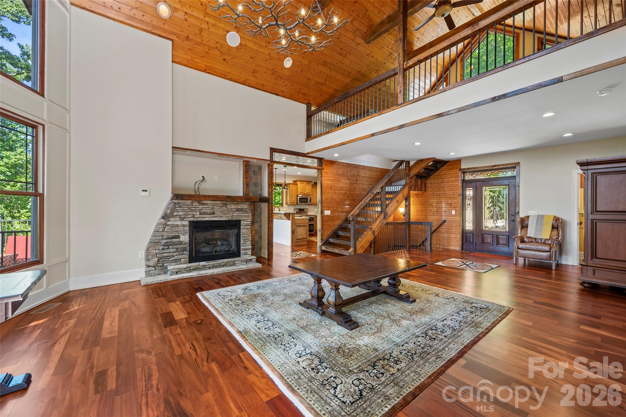 556 High Pines Loop Lake Lure, NC 28746 - Photo 5 of 46 a living room with furniture and a fireplace