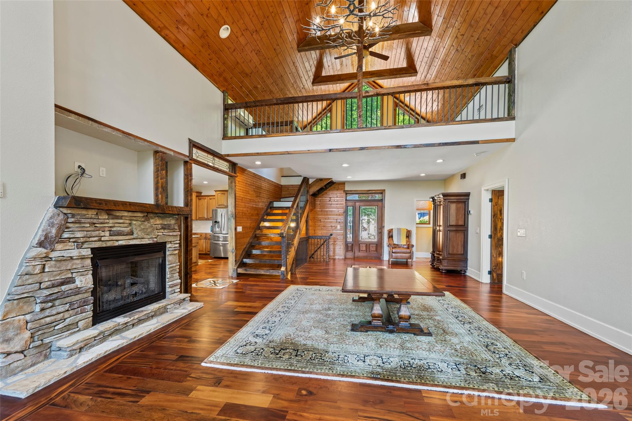 556 High Pines Loop Lake Lure, NC 28746 - Photo 6 of 46 a living room with furniture and a fireplace