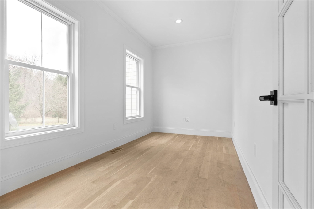 11 Couture Way Middleton, MA 01949 - Photo 11 of 24 an empty room with wooden floor and windows