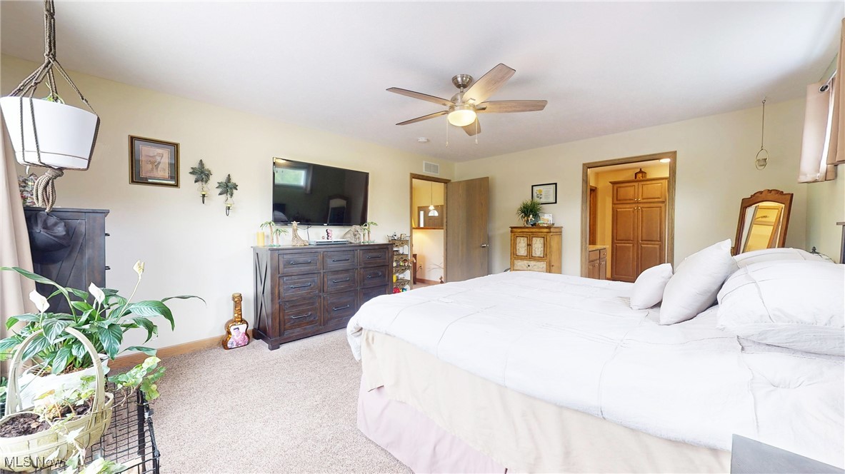 961 Industry Road Atwater, OH 44201 - Photo 12 of 50 Bedroom featuring light carpet and ceiling fan