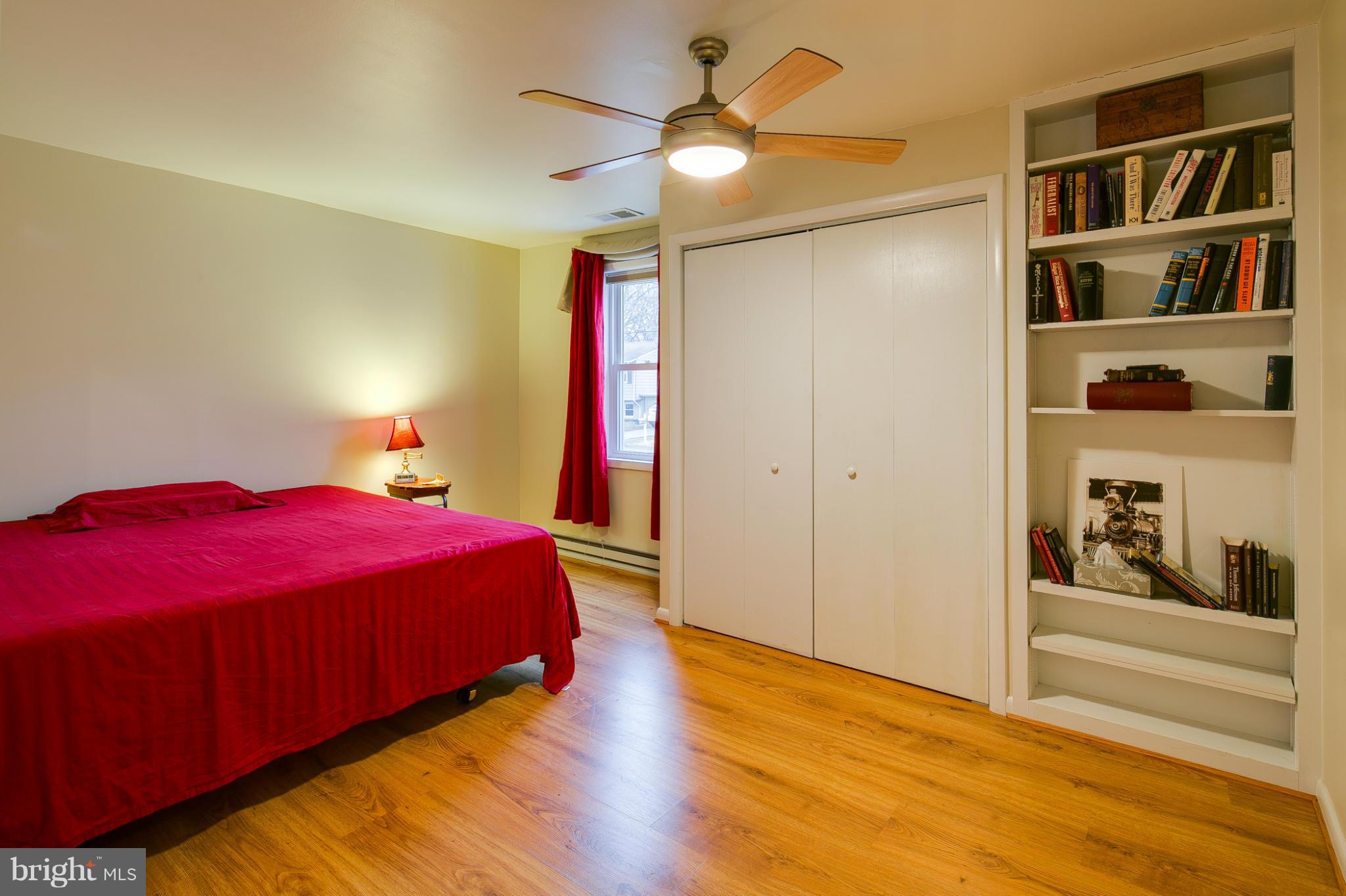 1640 Marlboro Road Edgewater, MD 21037 - Photo 14 of 27 a bed room with a bed and a book shelf