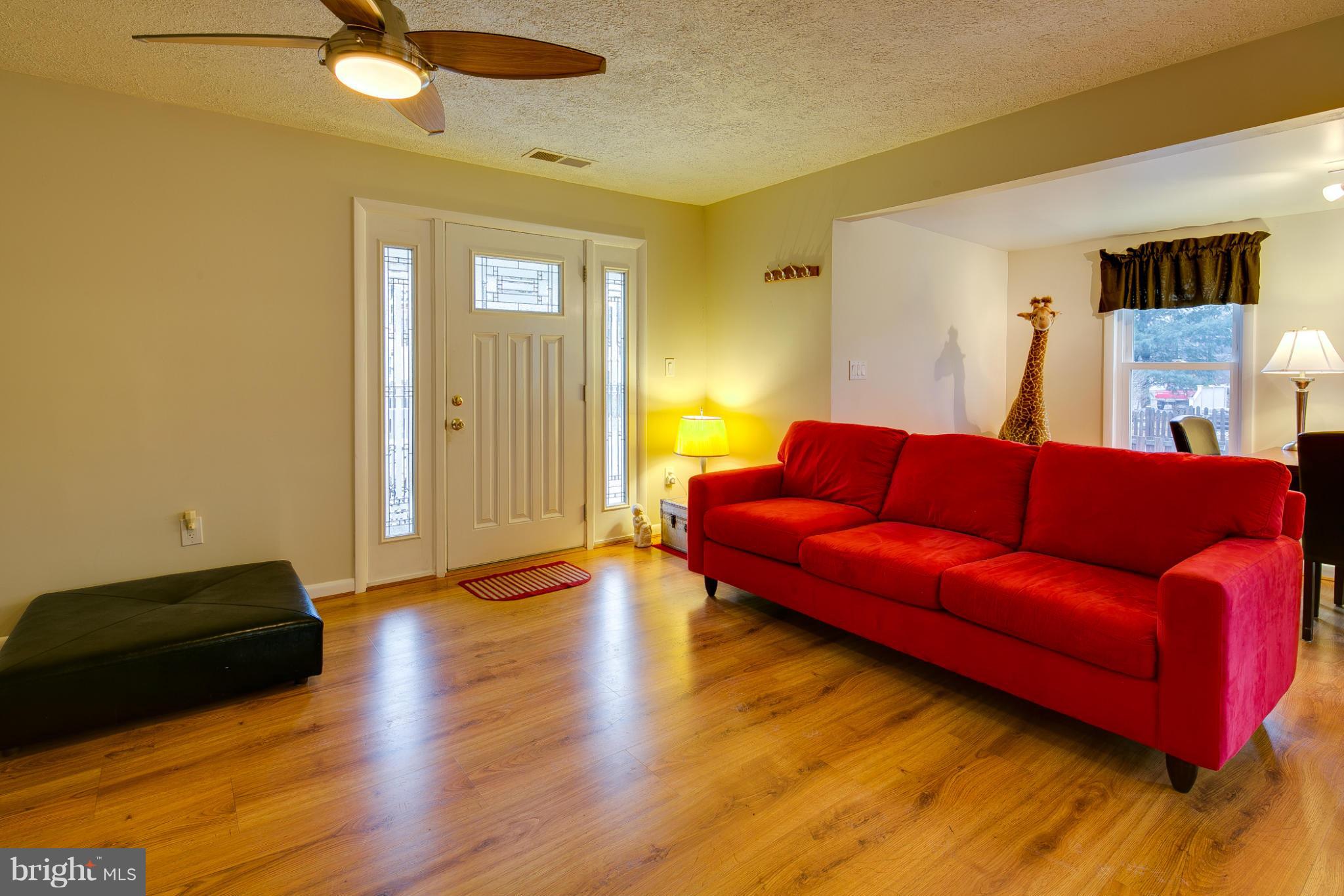 1640 Marlboro Road Edgewater, MD 21037 - Photo 22 of 27 a living room with furniture and a ceiling fan