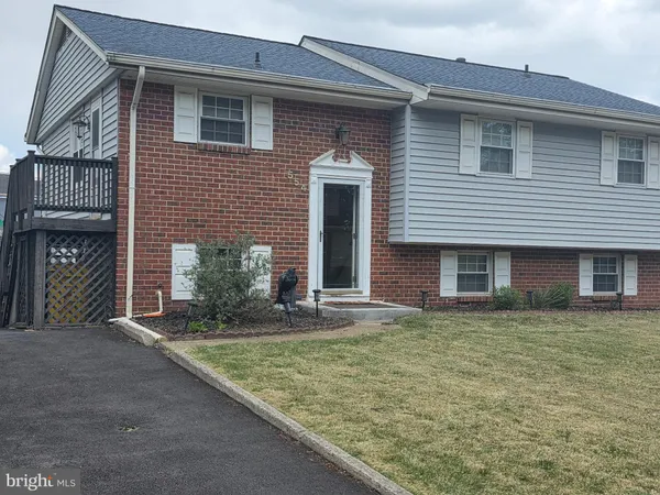 a front view of a house with yard