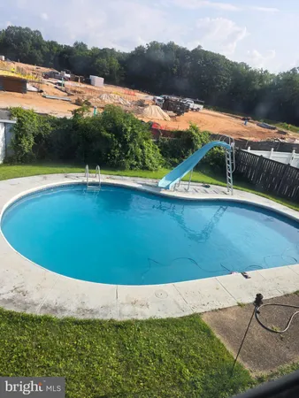 a view of swimming pool with lake view