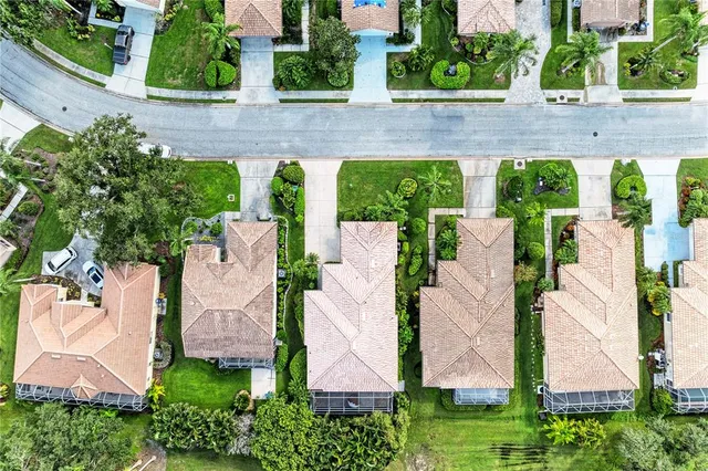 a living room with fireplace furniture and a floor to ceiling window