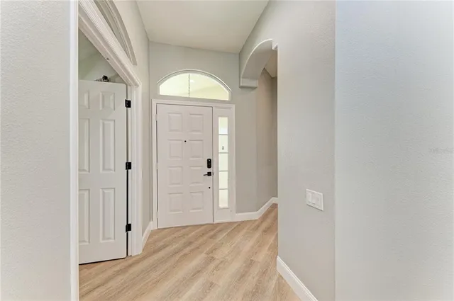 a bedroom with a bed and flat screen tv