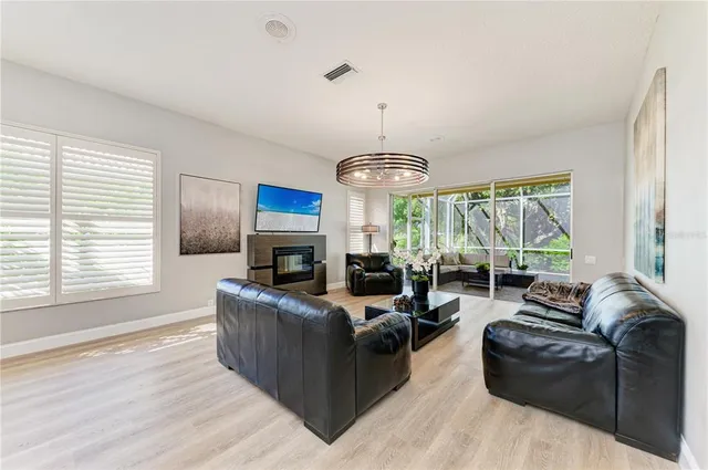 a view of a livingroom with lounge chair and a window