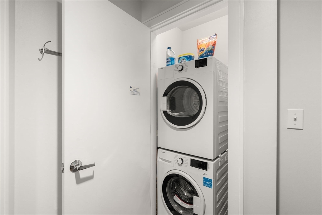 2400 Beacon Street, Unit 112 Boston, MA 02467 - Photo 12 of 21 a utility room with dryer and washer