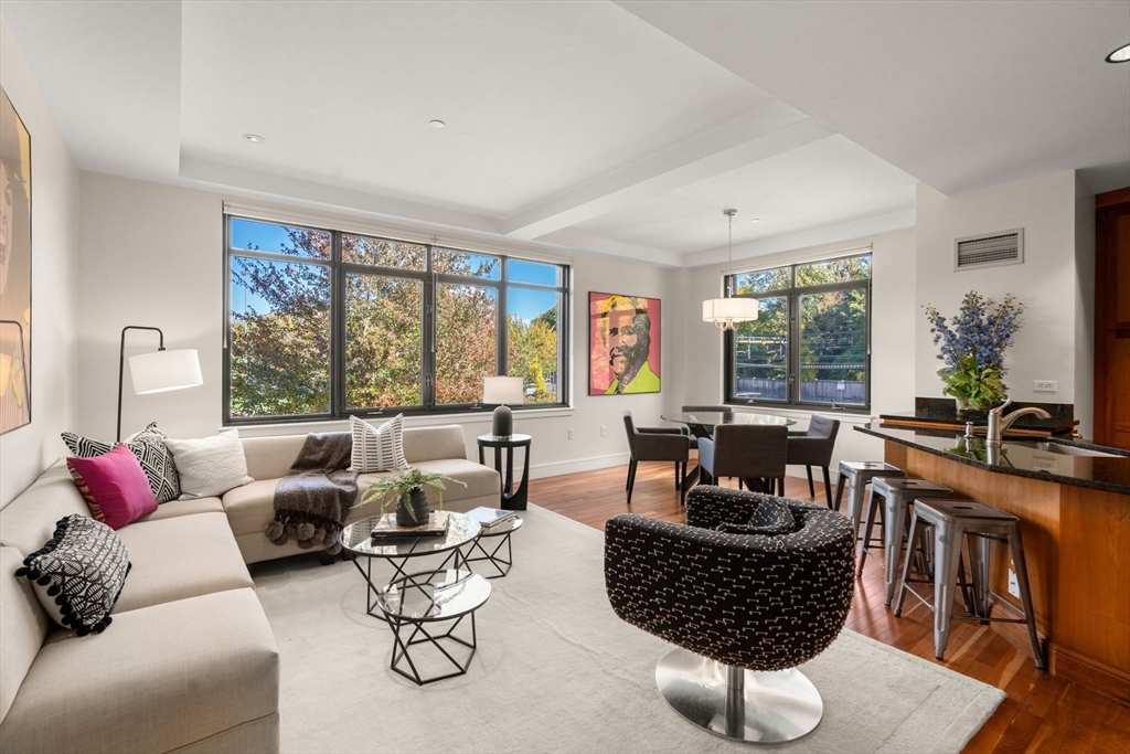 2400 Beacon Street, Unit 112 Boston, MA 02467 - Photo 4 of 21 a living room with furniture and a large window