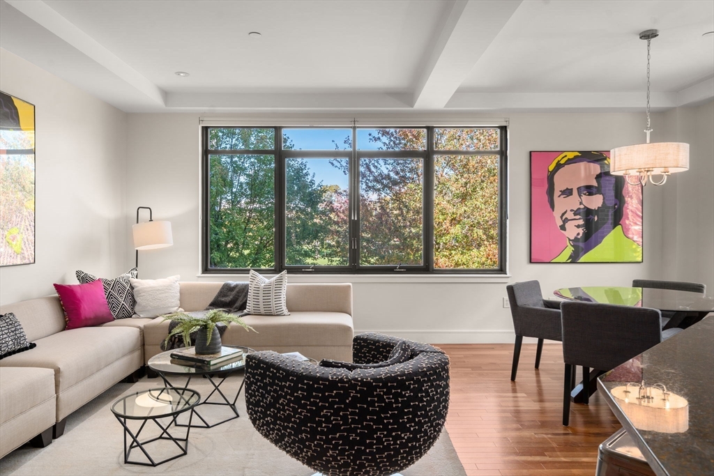 2400 Beacon Street, Unit 112 Boston, MA 02467 - Photo 5 of 21 a living room with furniture and a large window