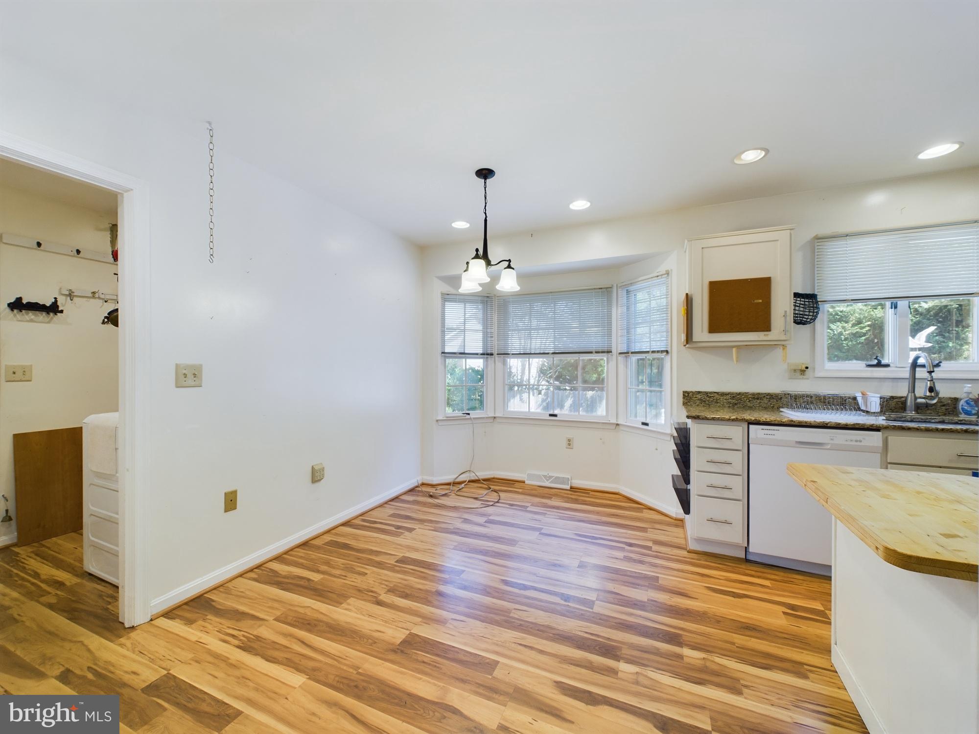 103 Birchfield Drive Dover, DE 19904 - Photo 13 of 44 a kitchen with granite countertop a sink cabinets and wooden floor