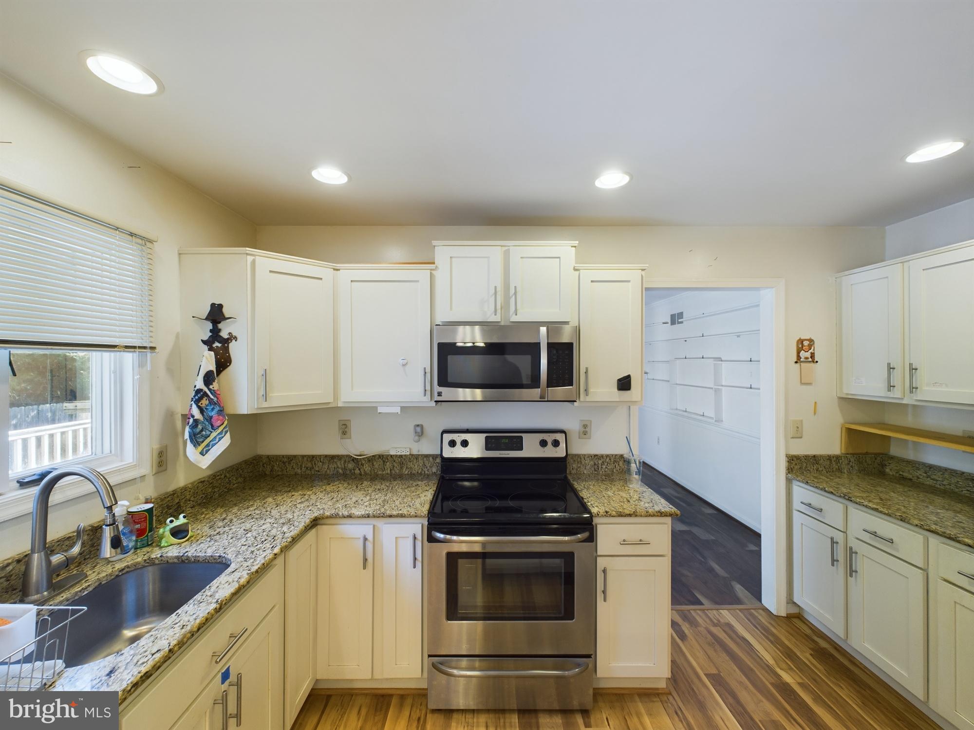 103 Birchfield Drive Dover, DE 19904 - Photo 14 of 44 a kitchen with a sink stove and refrigerator