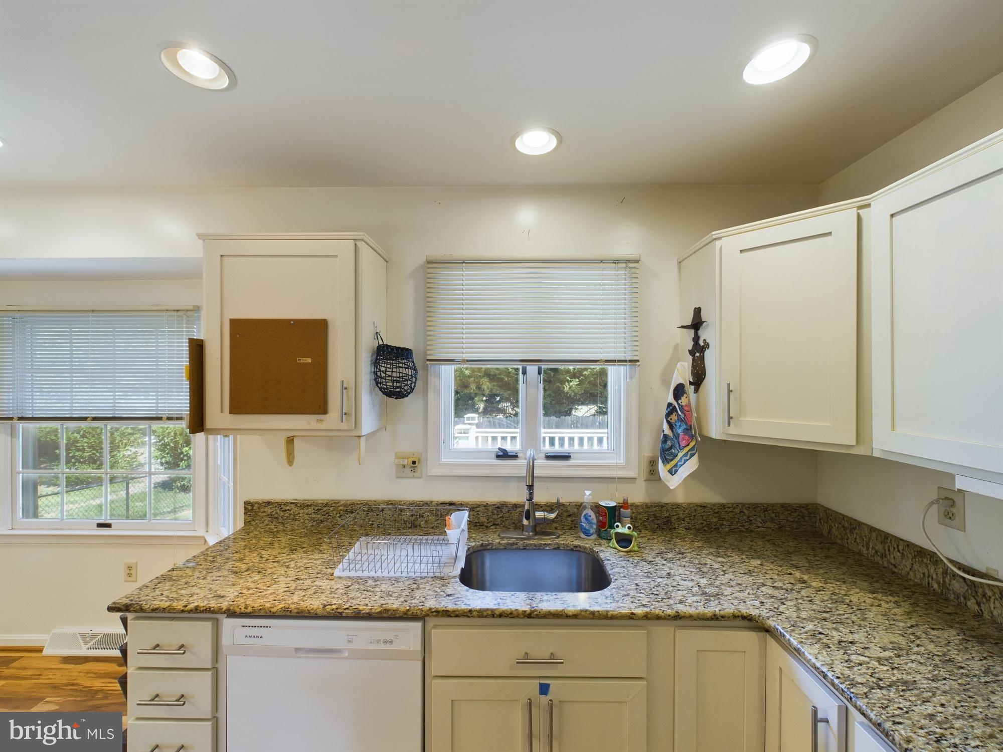 103 Birchfield Drive Dover, DE 19904 - Photo 16 of 44 a kitchen with granite countertop a sink and a window