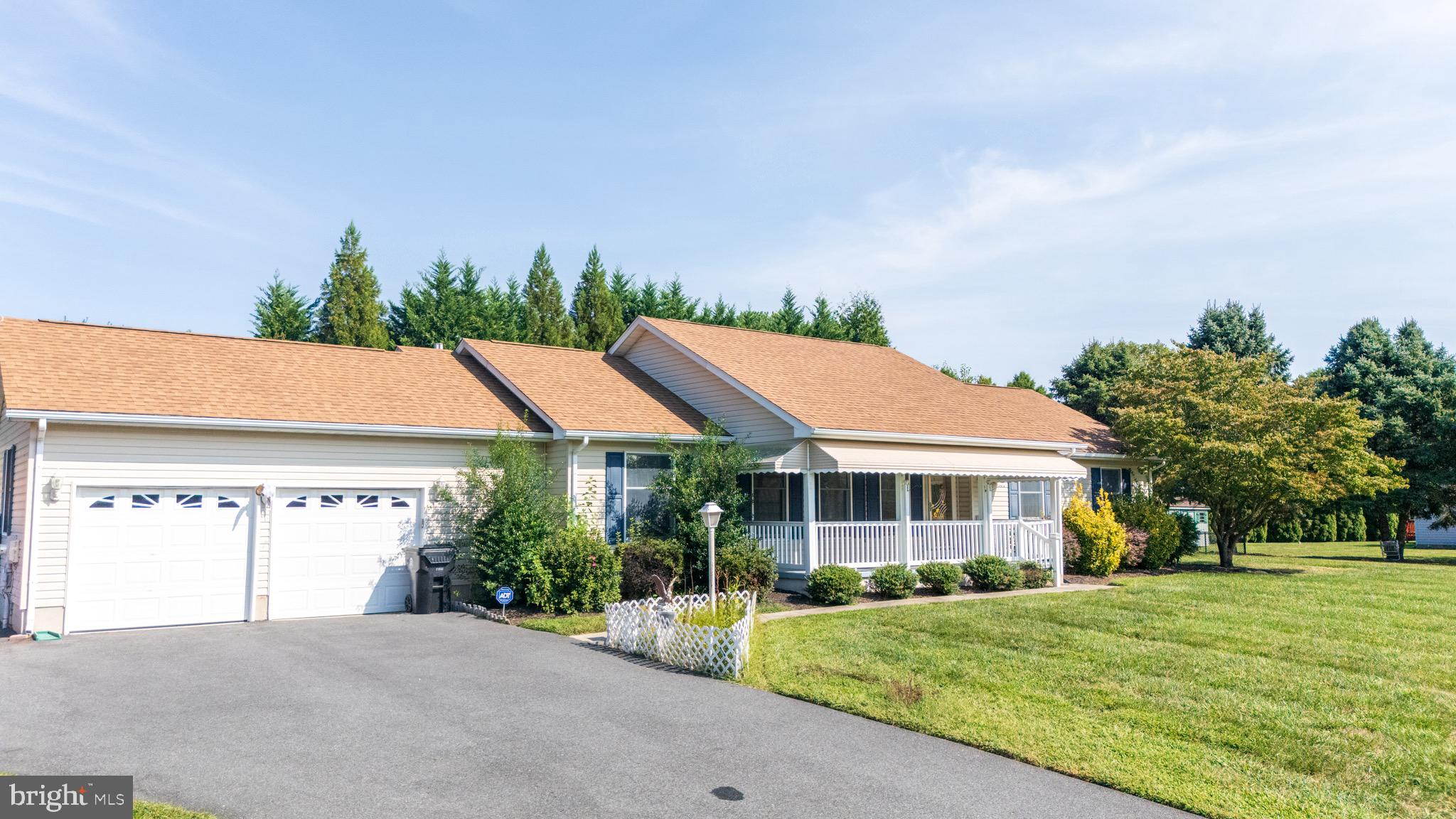 103 Birchfield Drive Dover, DE 19904 - Photo 3 of 44 a front view of a house with a yard and trees