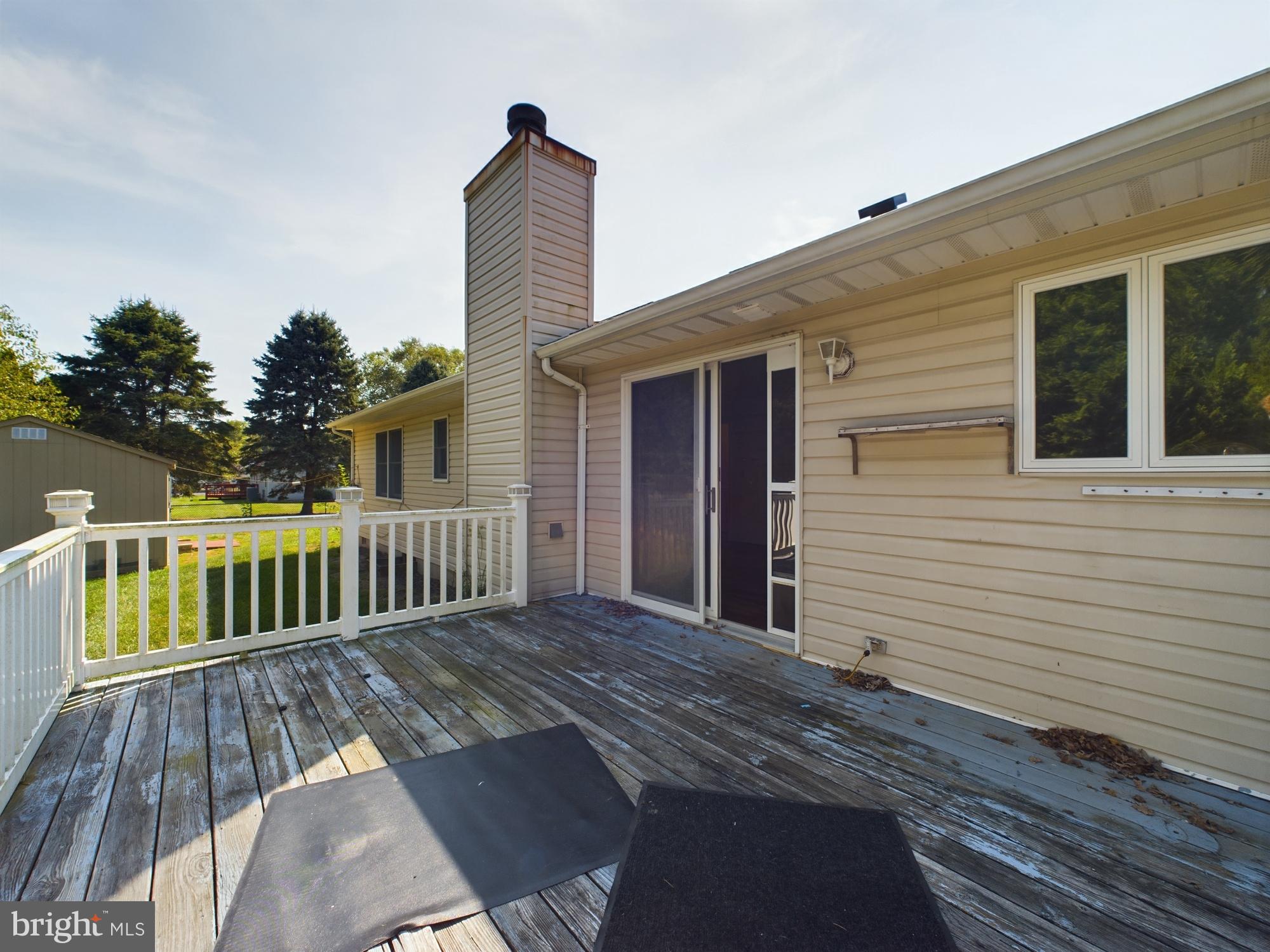 103 Birchfield Drive Dover, DE 19904 - Photo 35 of 44 a view of a house with wooden deck