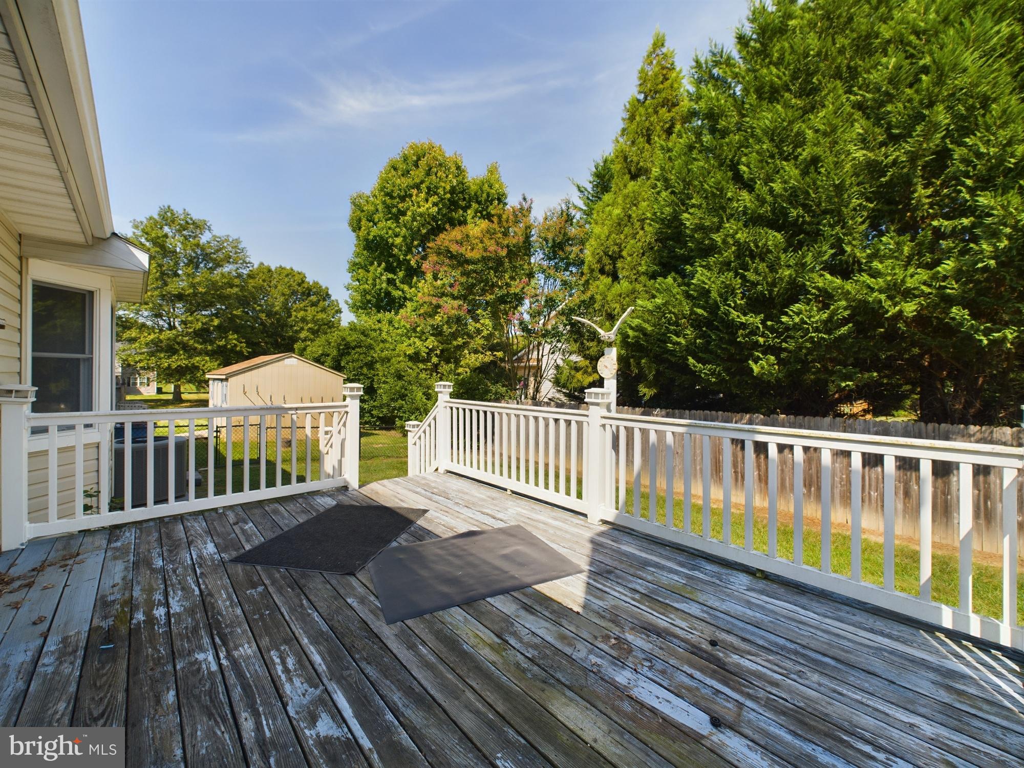 103 Birchfield Drive Dover, DE 19904 - Photo 36 of 44 a view of a wooden deck with a yard