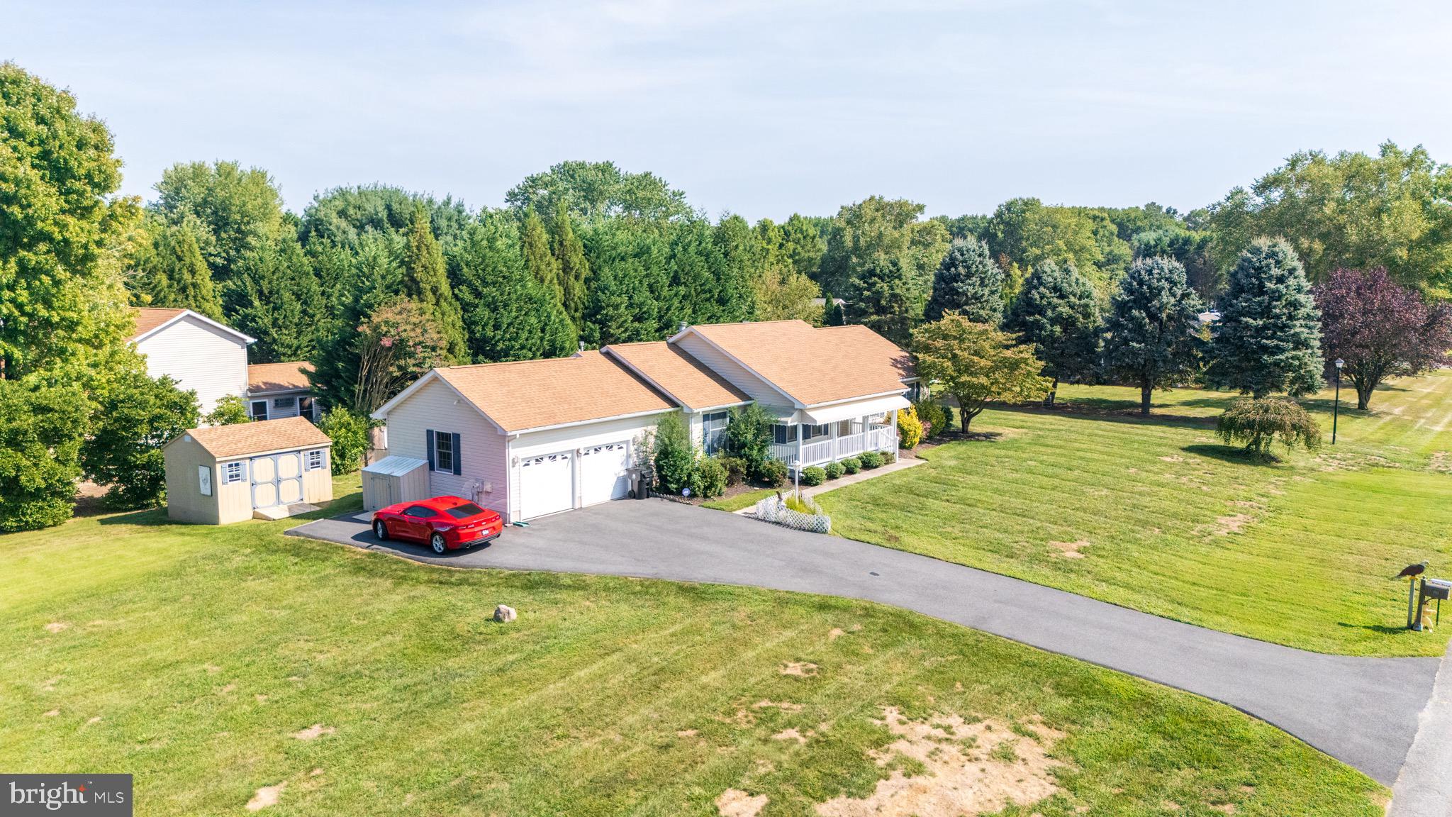 103 Birchfield Drive Dover, DE 19904 - Photo 40 of 44 a view of a pool with an outdoor space and seating area