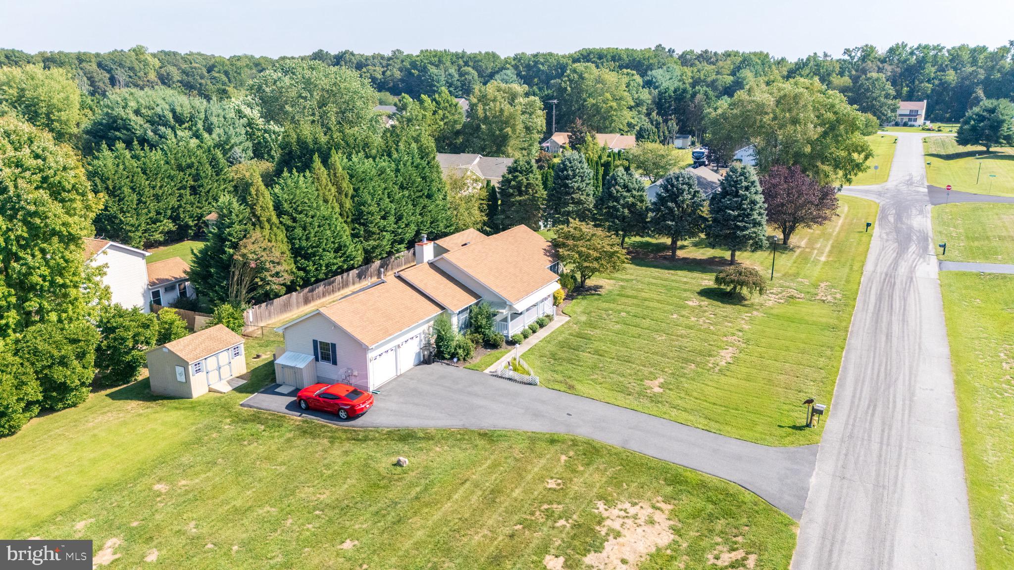 103 Birchfield Drive Dover, DE 19904 - Photo 41 of 44 a view of a swimming pool with a yard and trees