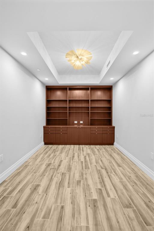 800 Collany Road, Unit 302 St. Petersburg, FL 33715 - Photo 23 of 66 a view of room with wooden floor