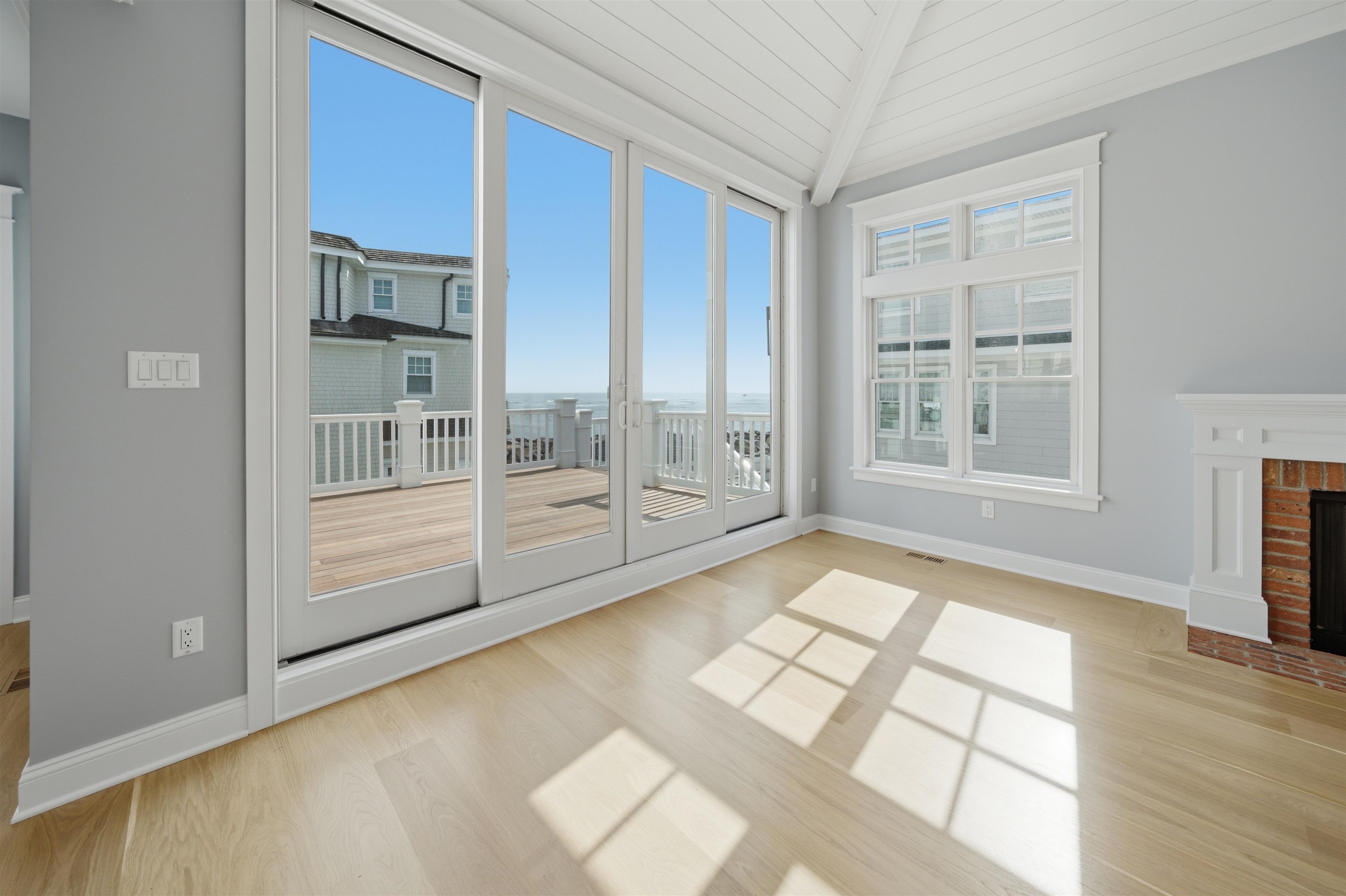 135 7th Street Avalon, NJ 08202 - Photo 12 of 50 a view of an empty room with a window and wooden floor