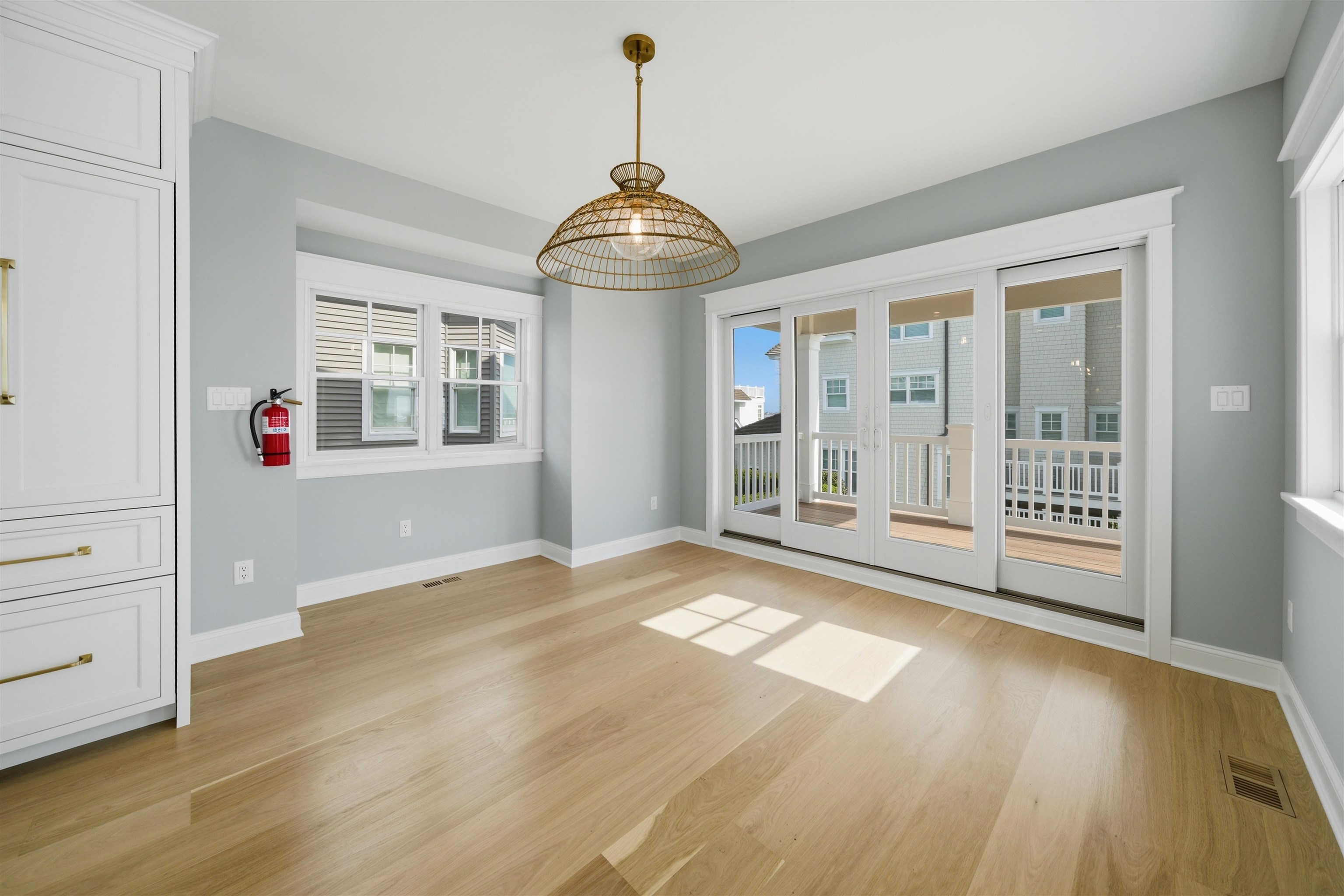 135 7th Street Avalon, NJ 08202 - Photo 20 of 50 a view of an empty room with a window and wooden floor
