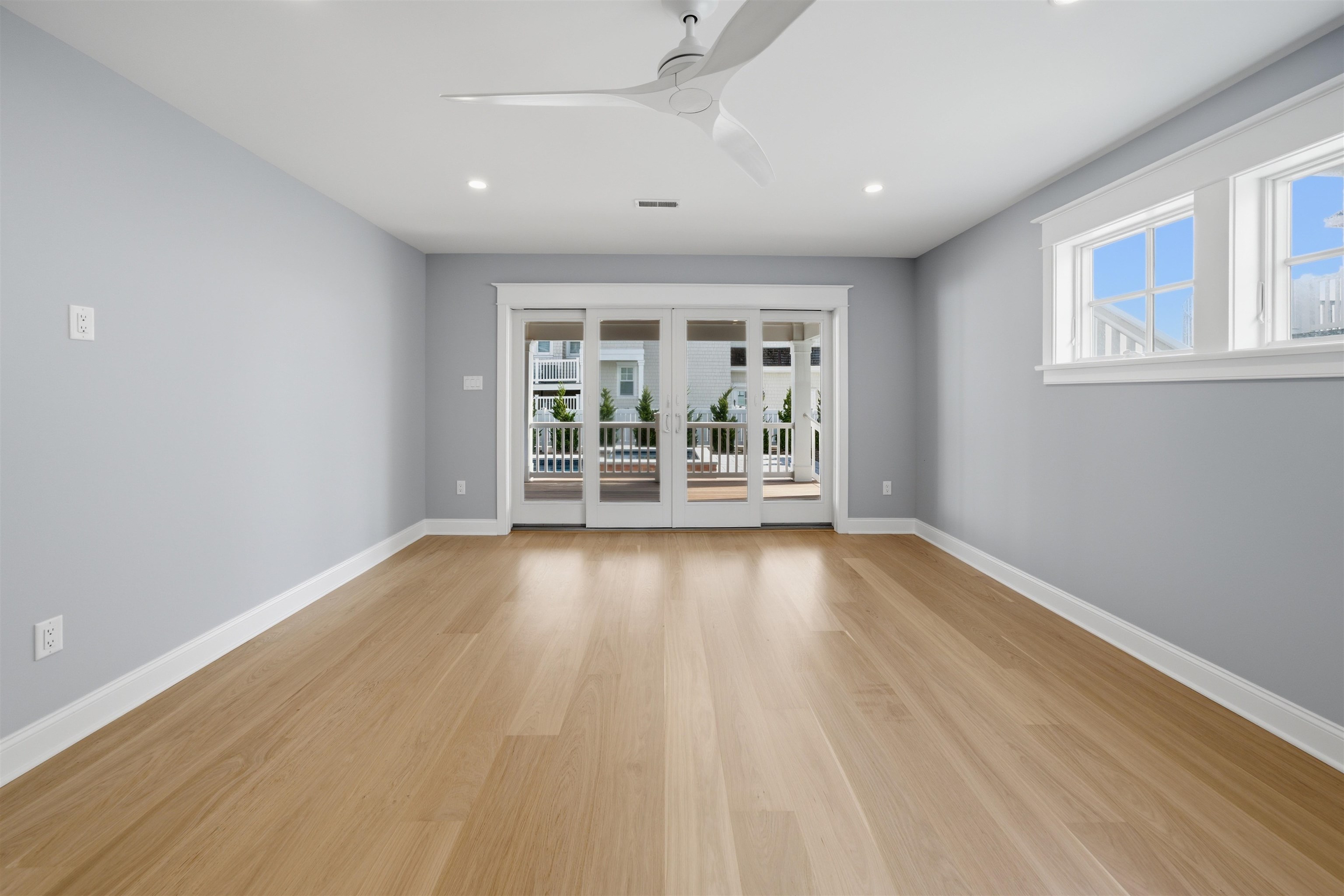 135 7th Street Avalon, NJ 08202 - Photo 25 of 50 wooden floor in an empty room with a window