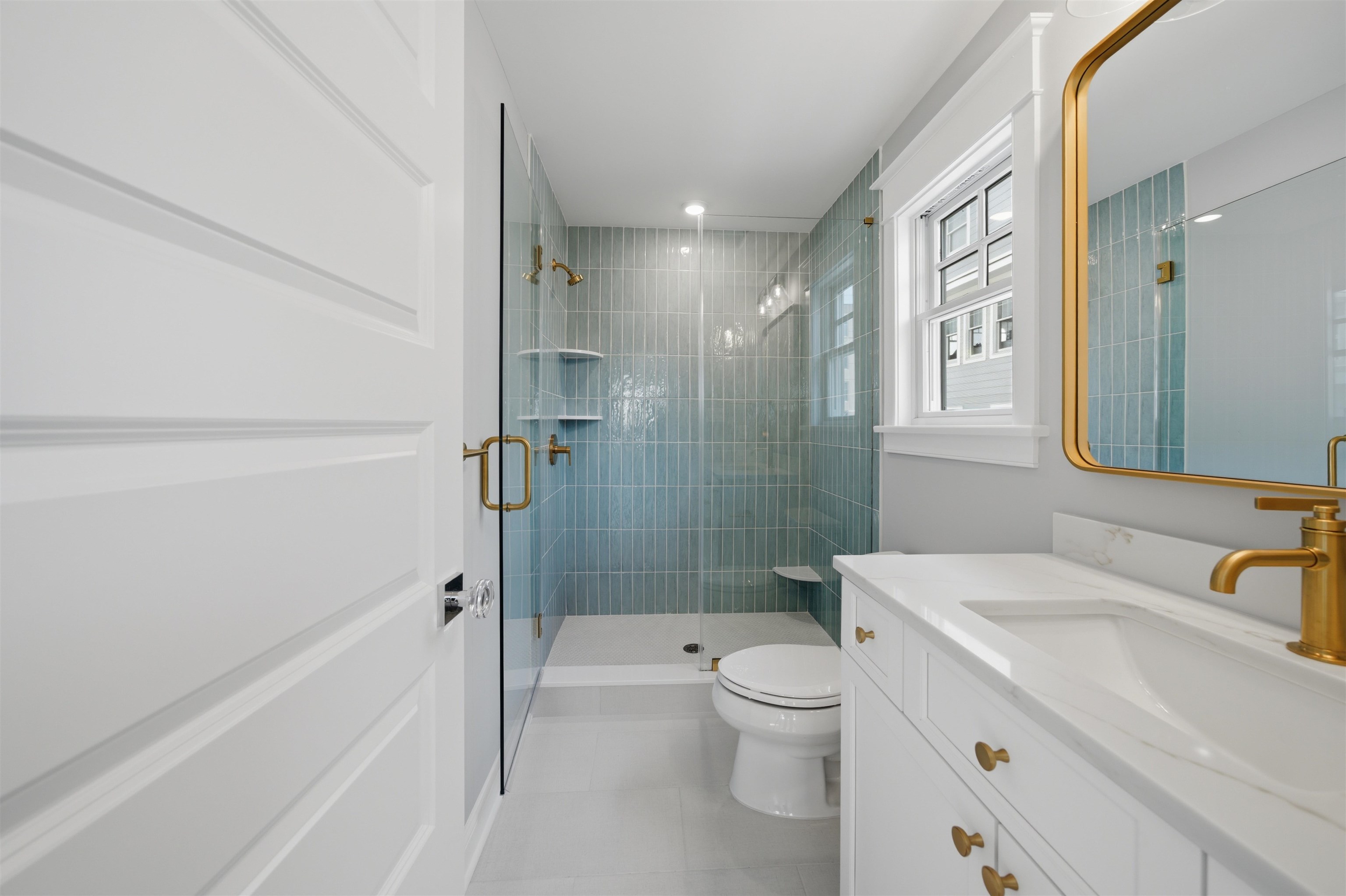 135 7th Street Avalon, NJ 08202 - Photo 30 of 50 a bathroom with a sink a toilet and shower