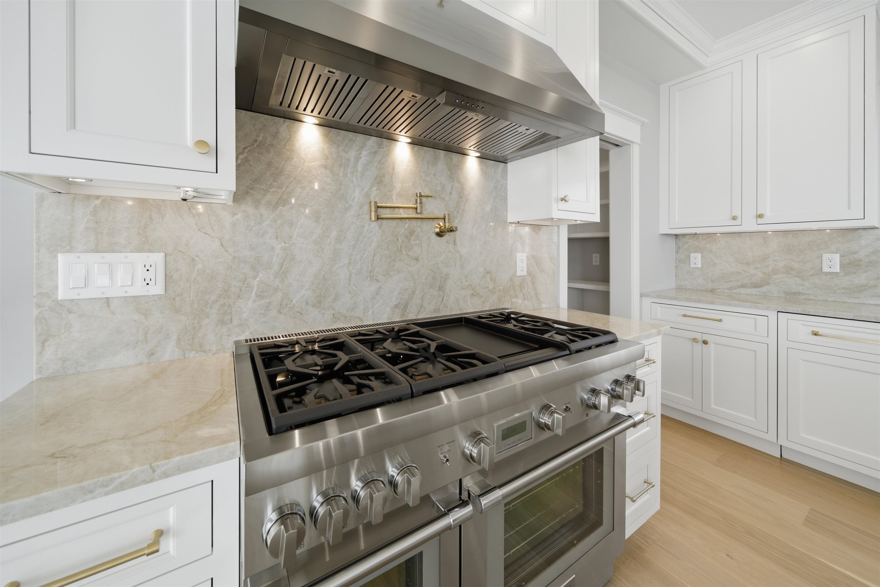 135 7th Street Avalon, NJ 08202 - Photo 10 of 50 a stove top oven sitting inside of a kitchen