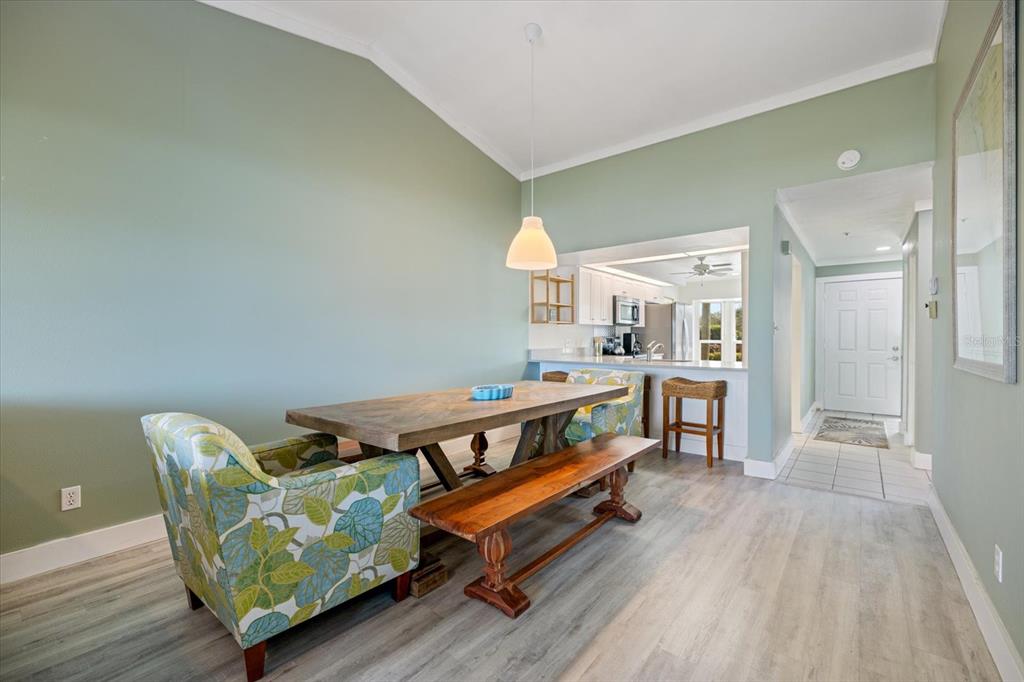 841 Waterside Drive, Unit 202 Venice, FL 34285 - Photo 13 of 43 a room with furniture and a wooden floor