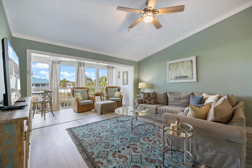 841 Waterside Drive, Unit 202 Venice, FL 34285 - Photo 16 of 43 a living room with furniture and a large window