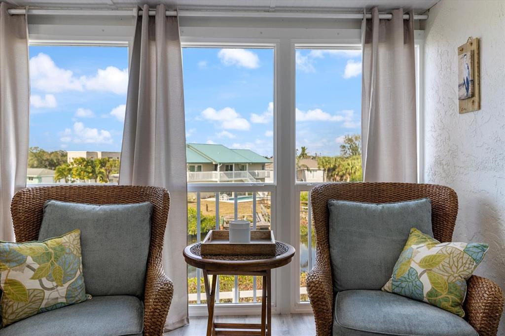 841 Waterside Drive, Unit 202 Venice, FL 34285 - Photo 19 of 43 a living room with furniture and a window